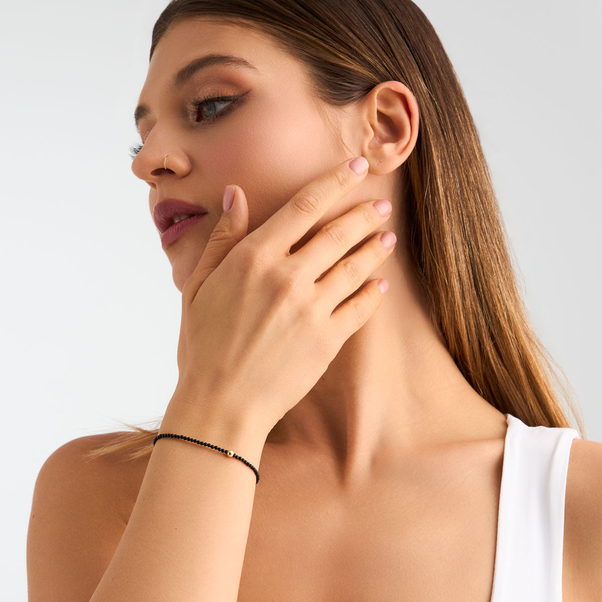 Bransoletka srebrna pozłacana z onyksem