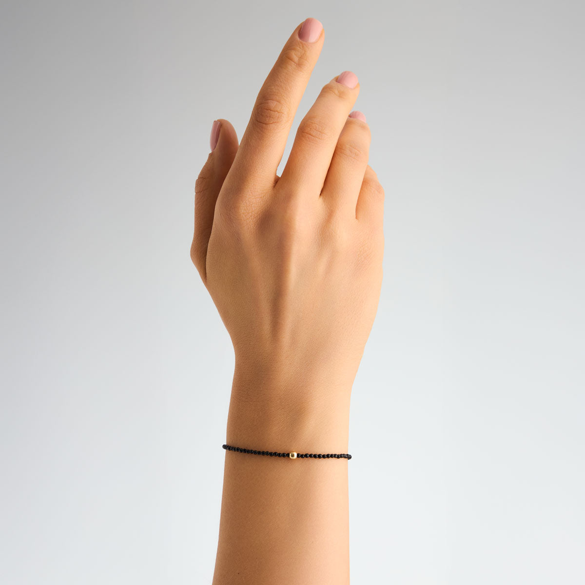 Bransoletka srebrna pozłacana z onyksem