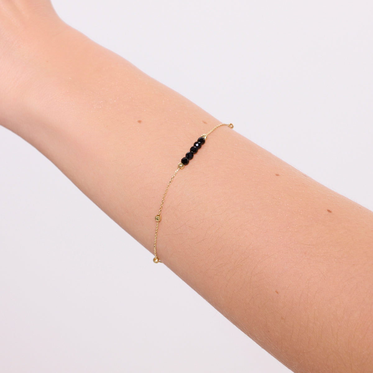 Bransoletka złota z czarnymi cyrkoniami - kulki